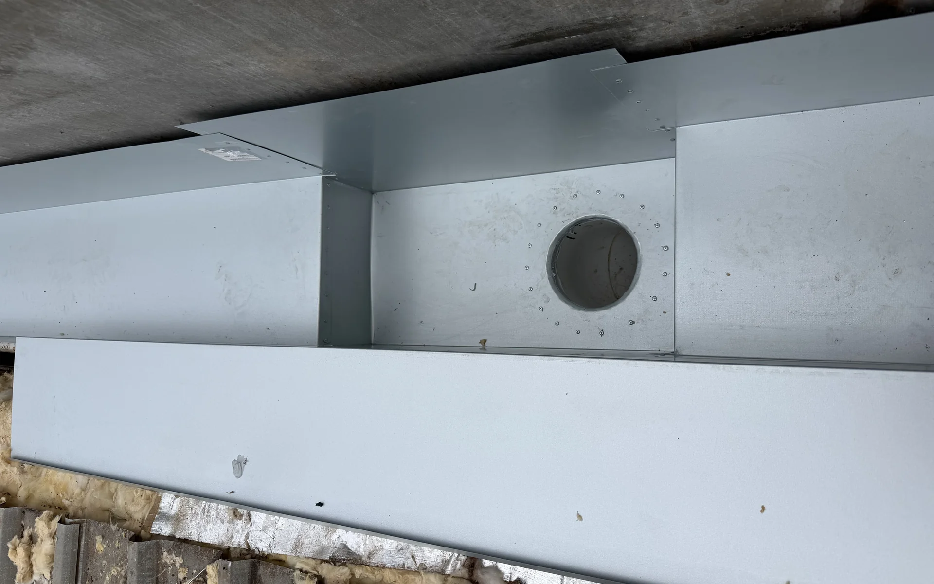 Box gutter with a sump outlet installed on a commercial building