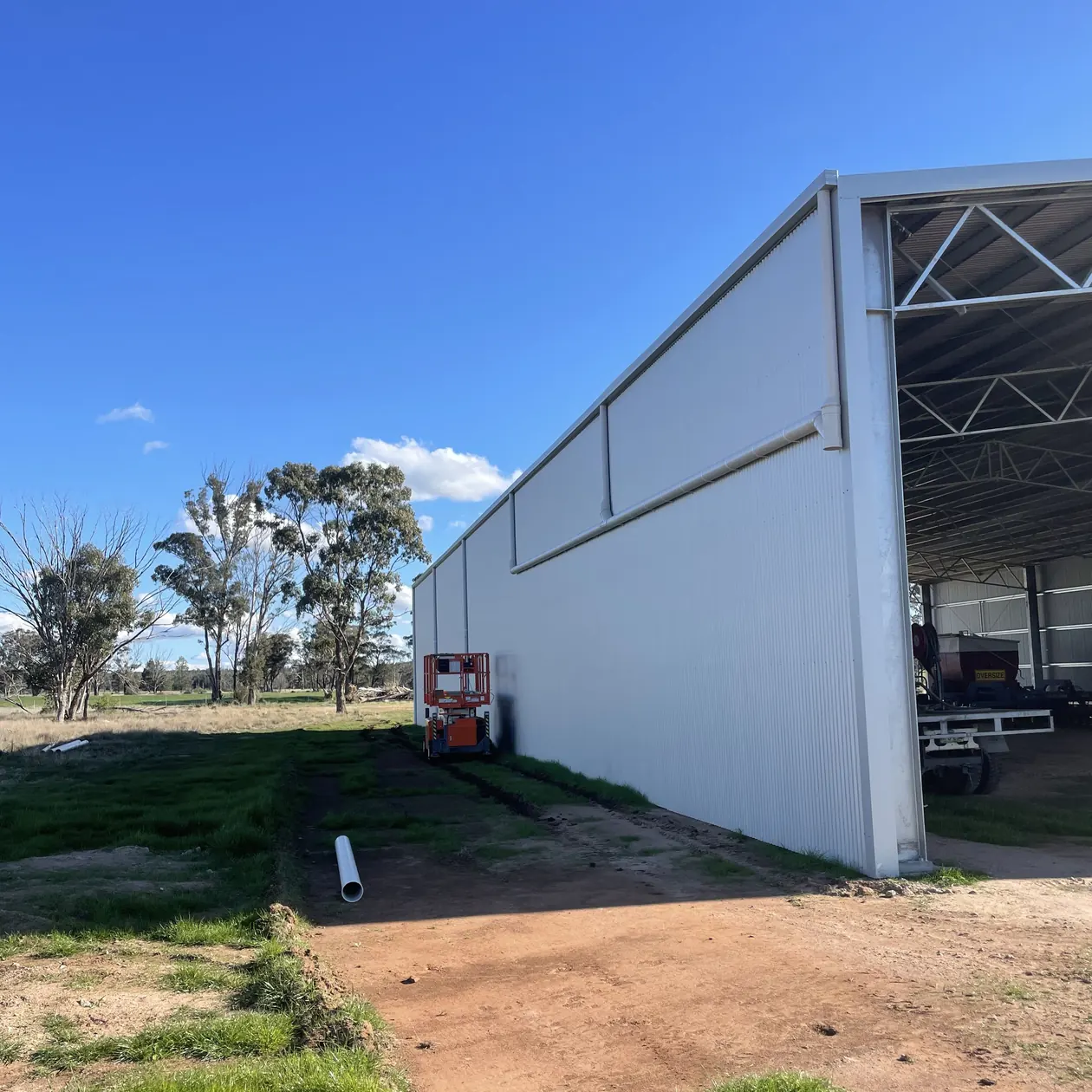 Completed metal cladding on the exterior of a large shed