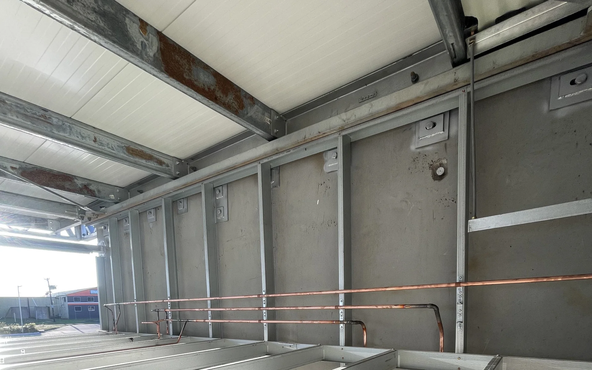 Copper water pipework installed through a stud wall