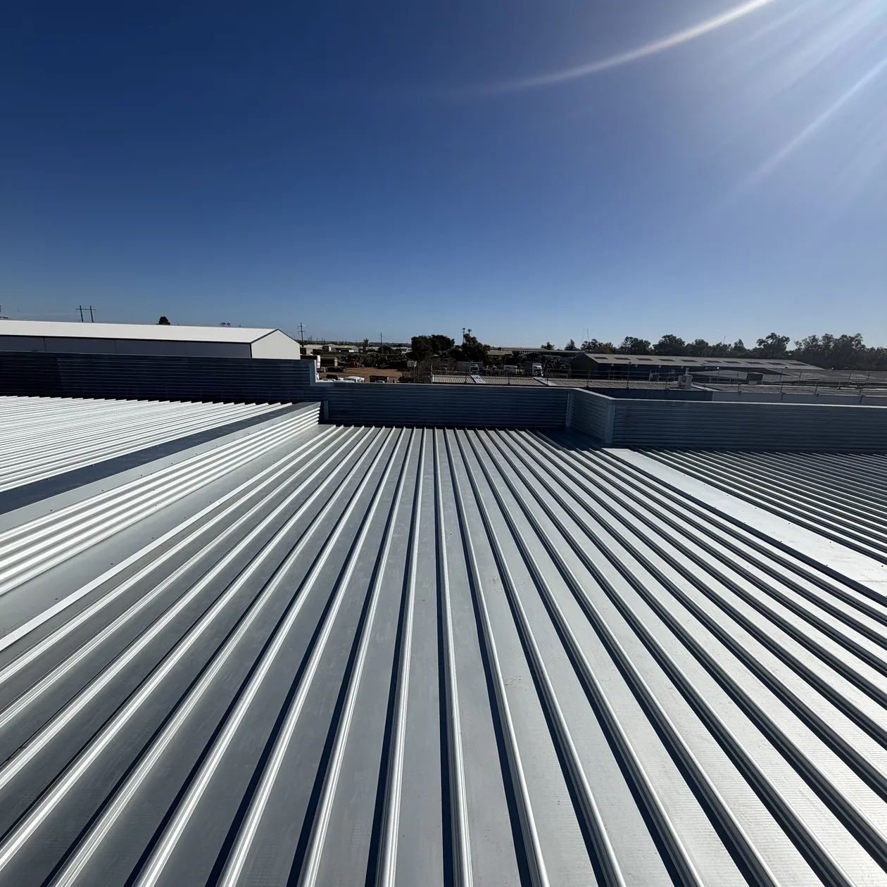 Klip-Lok metal roof sheeting installed across a commercial building