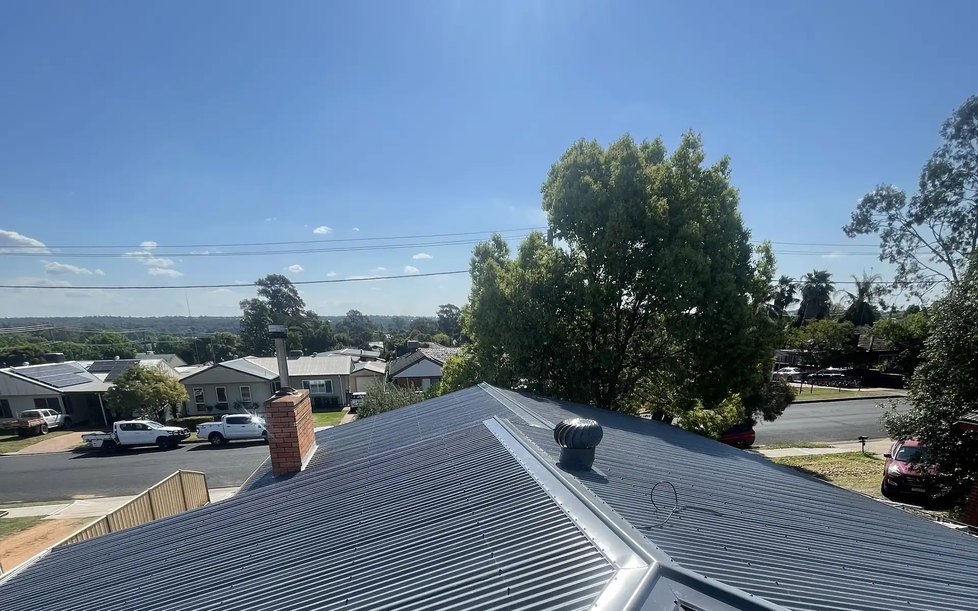 Finished Colorbond re-roof on a house with a hipped roof