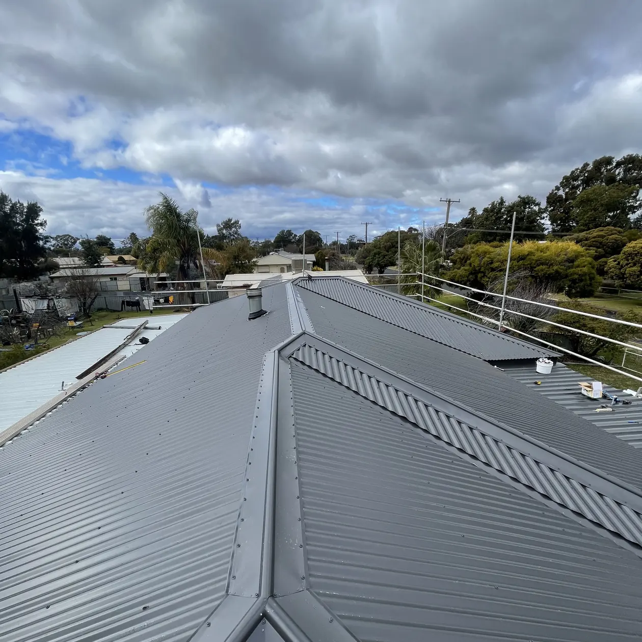 House re-roof in progress with scaffold and new sheeting going on