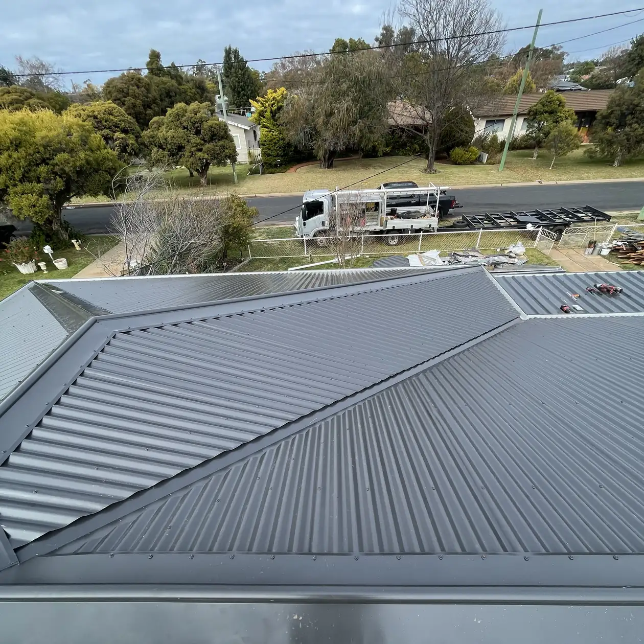 Metal roof on a house viewed from above with work in progress